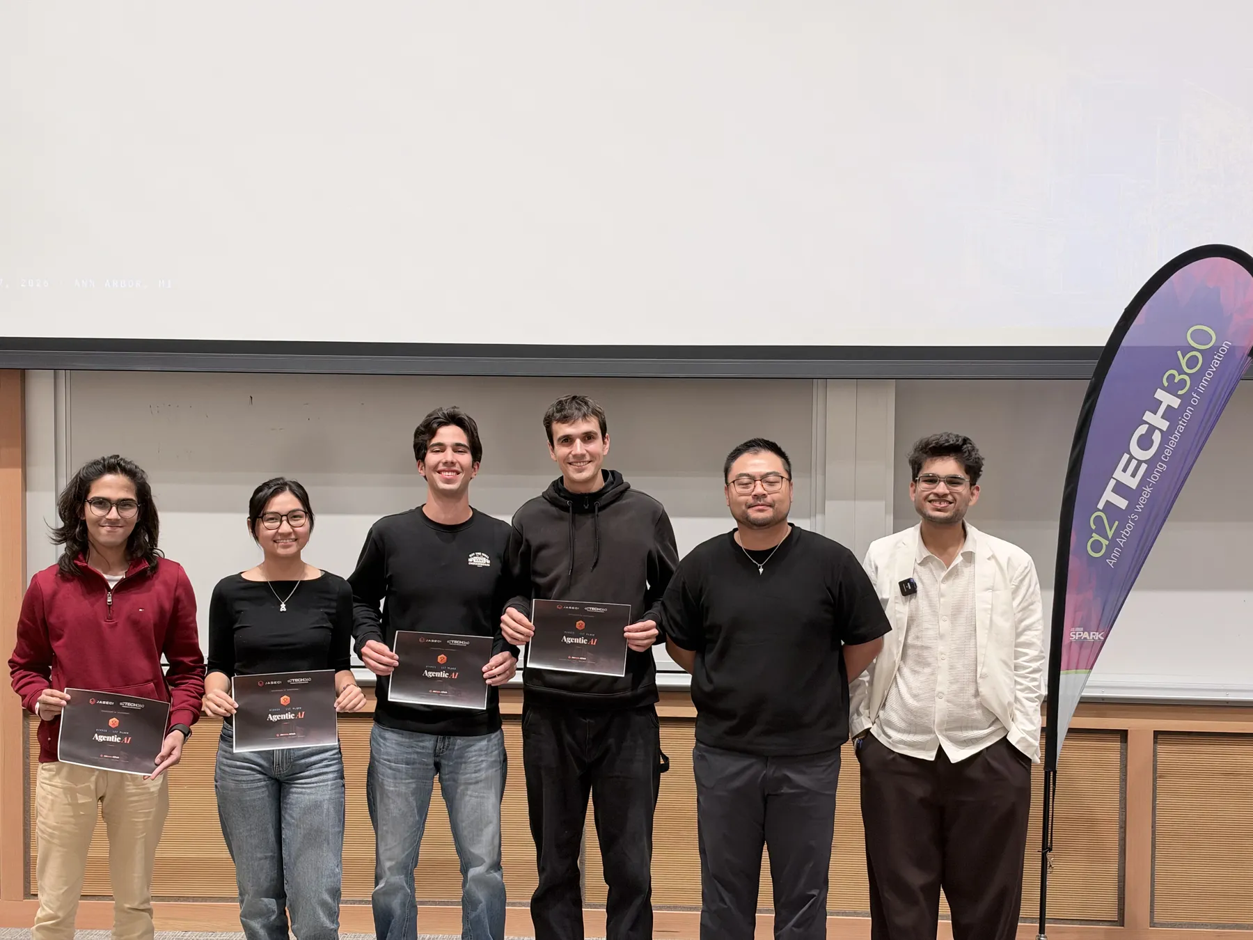 Award winners in front of the a2Tech360 banner