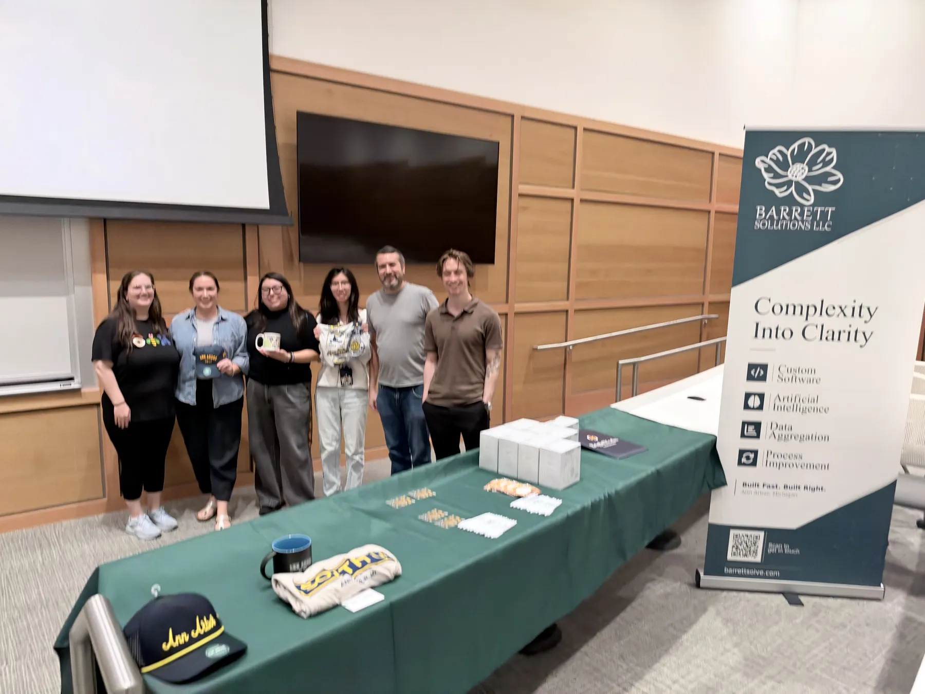 Prize presentation at the Barrett Solutions table