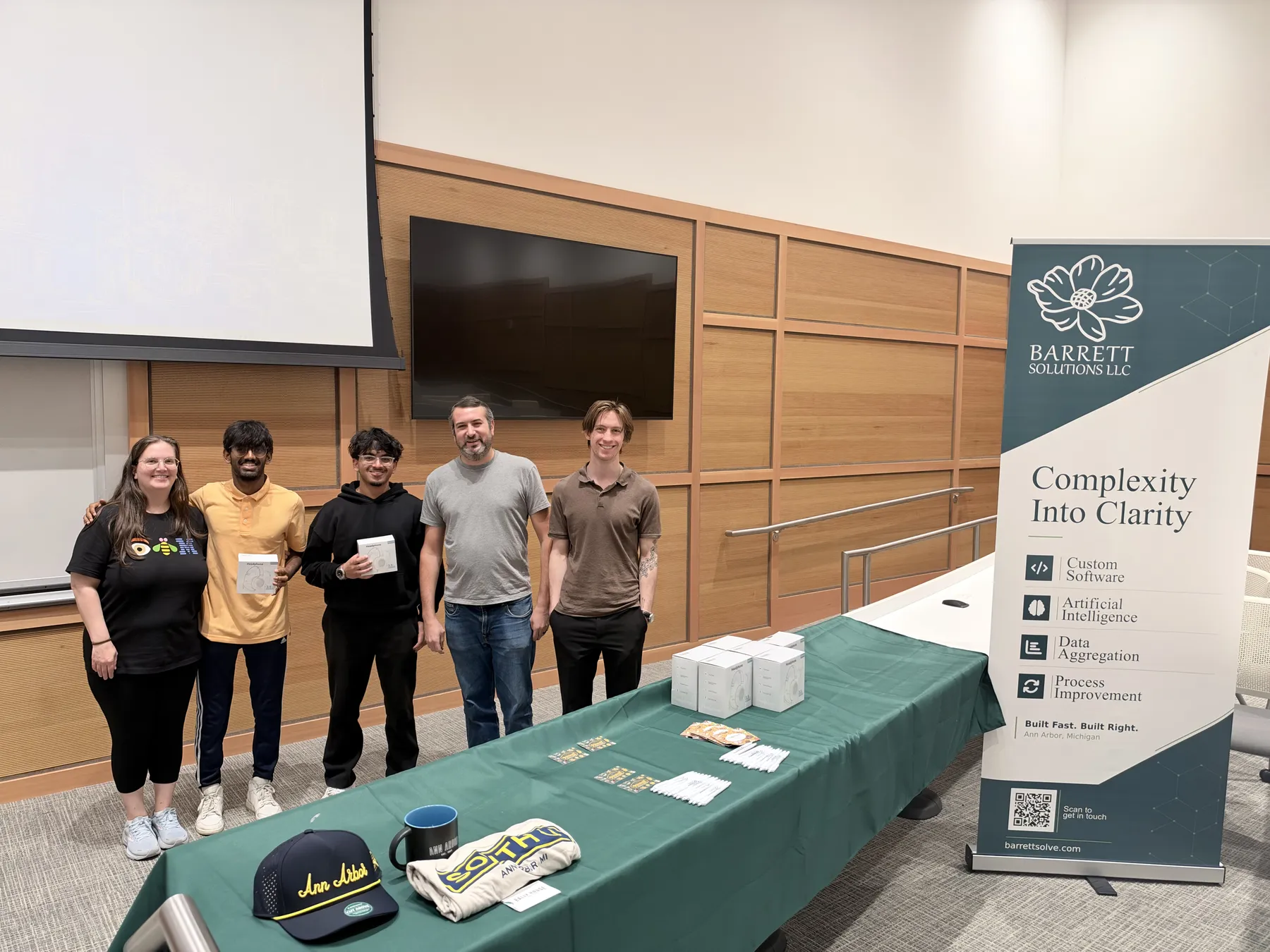 Winners lined up by the Barrett Solutions banner