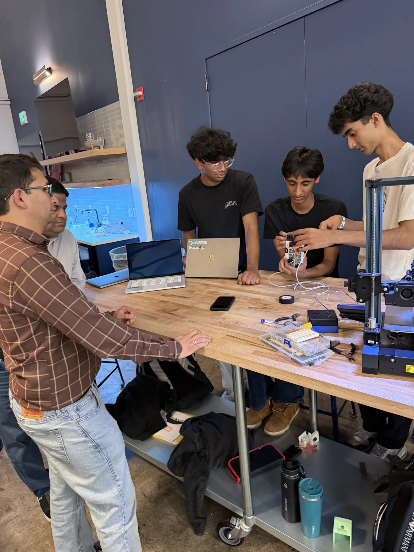 Mentor explaining hardware at JacHacks SF