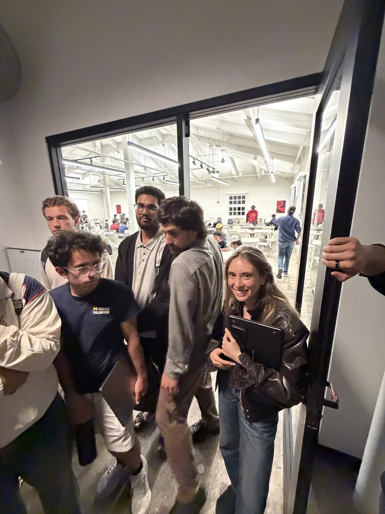 Builders moving between rooms at JacHacks SF