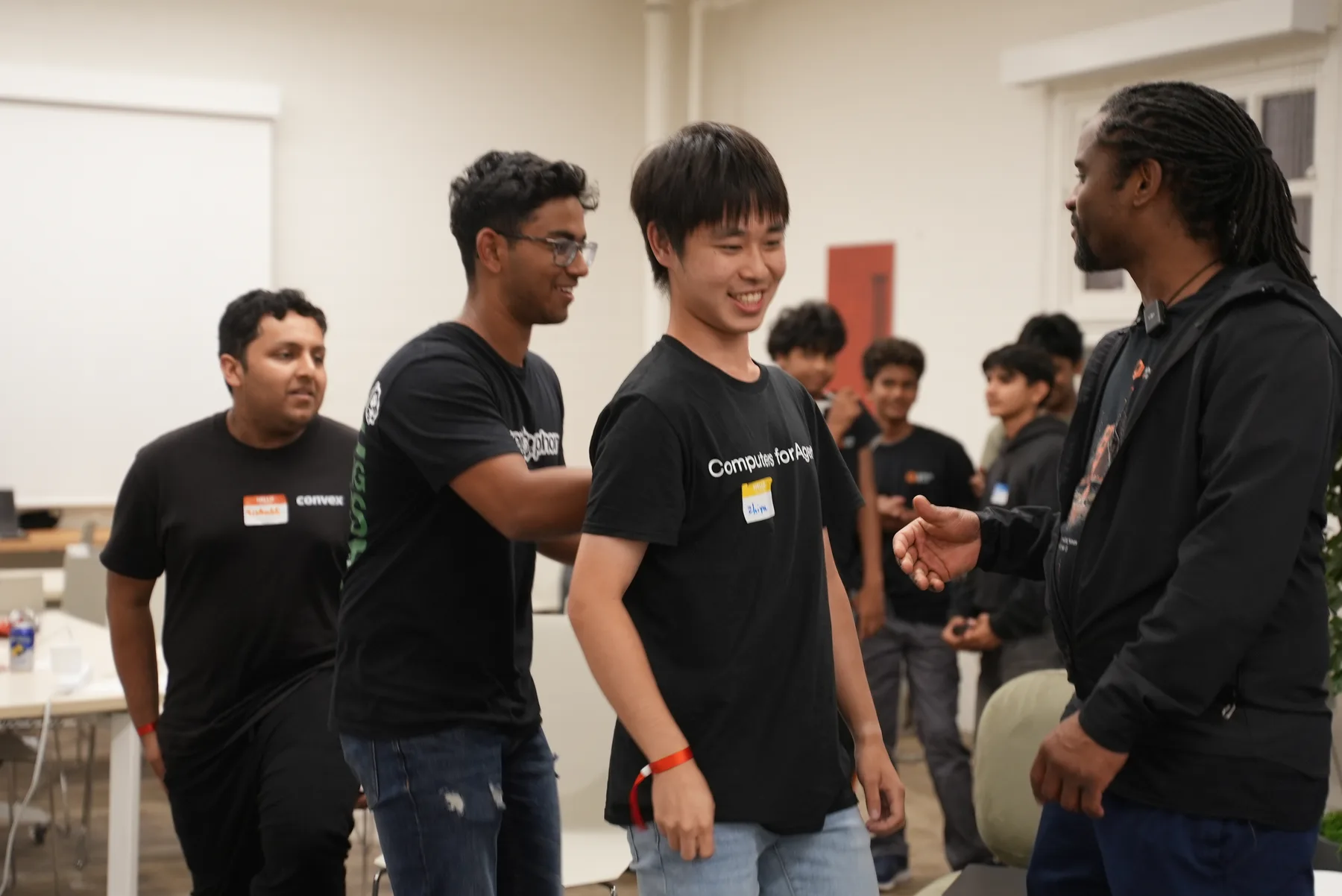 Organizers congratulating a builder