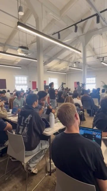 Audience watching the JacHacks SF kickoff