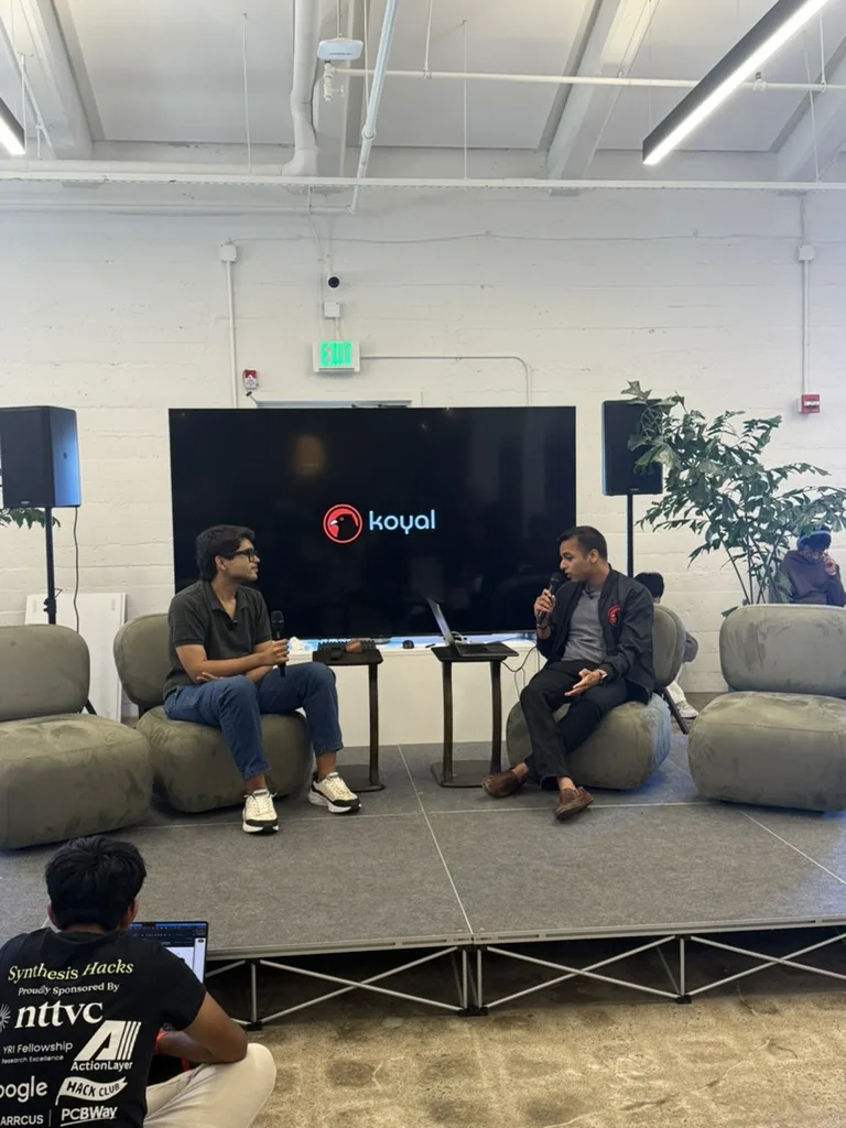 Fireside chat on stage at JacHacks SF