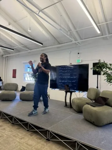 Speaker explaining code at JacHacks SF