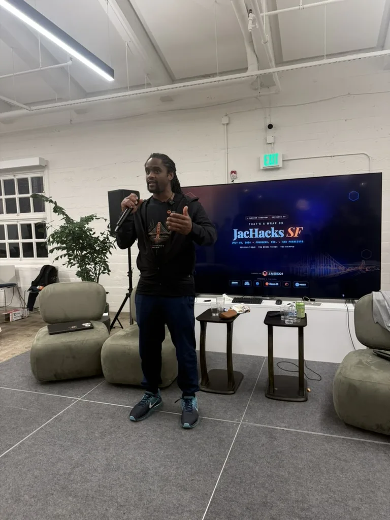 Speaker introducing the JacHacks SF challenge
